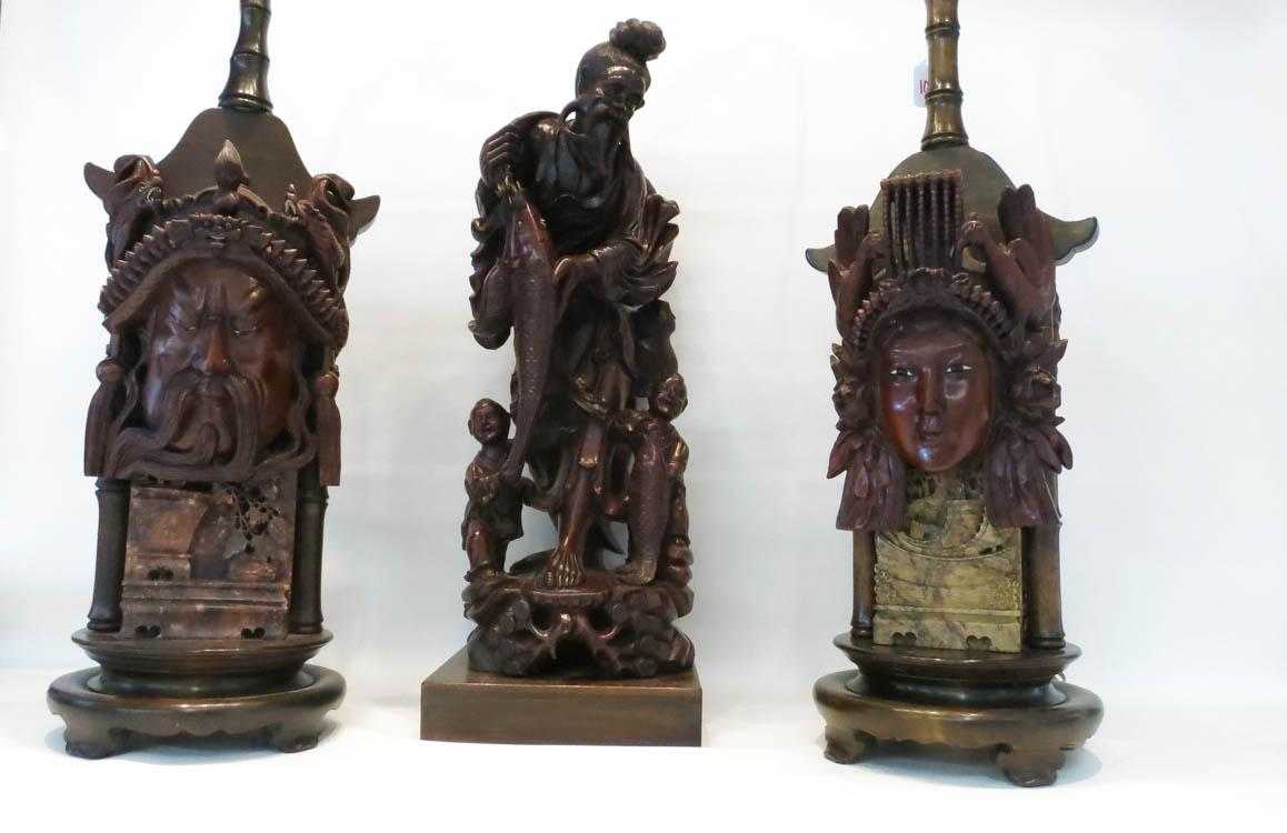 Appraisal: THREE WOOD CARVINGS figure of a Chinese fisherman and his