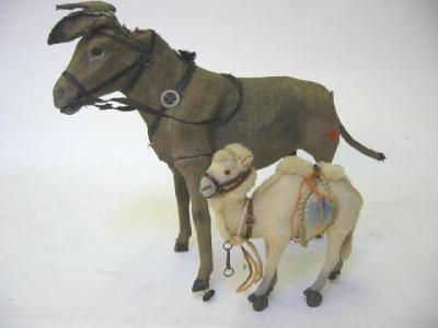 Appraisal: An early th century novelty donkey on wheels with pull