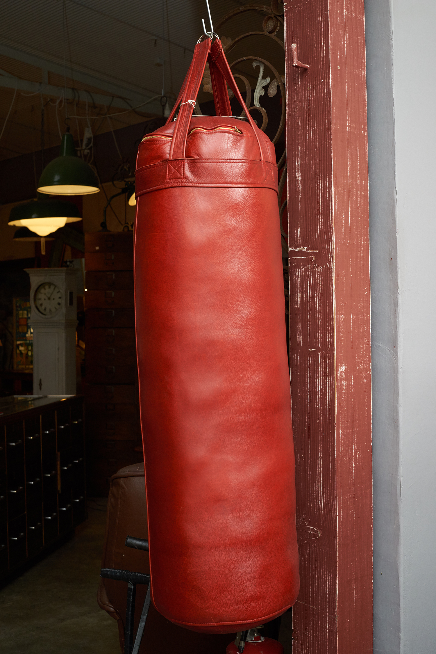 Appraisal: AN IMPRESSIVE LEATHER BOXING BAG Italian red leather filled with