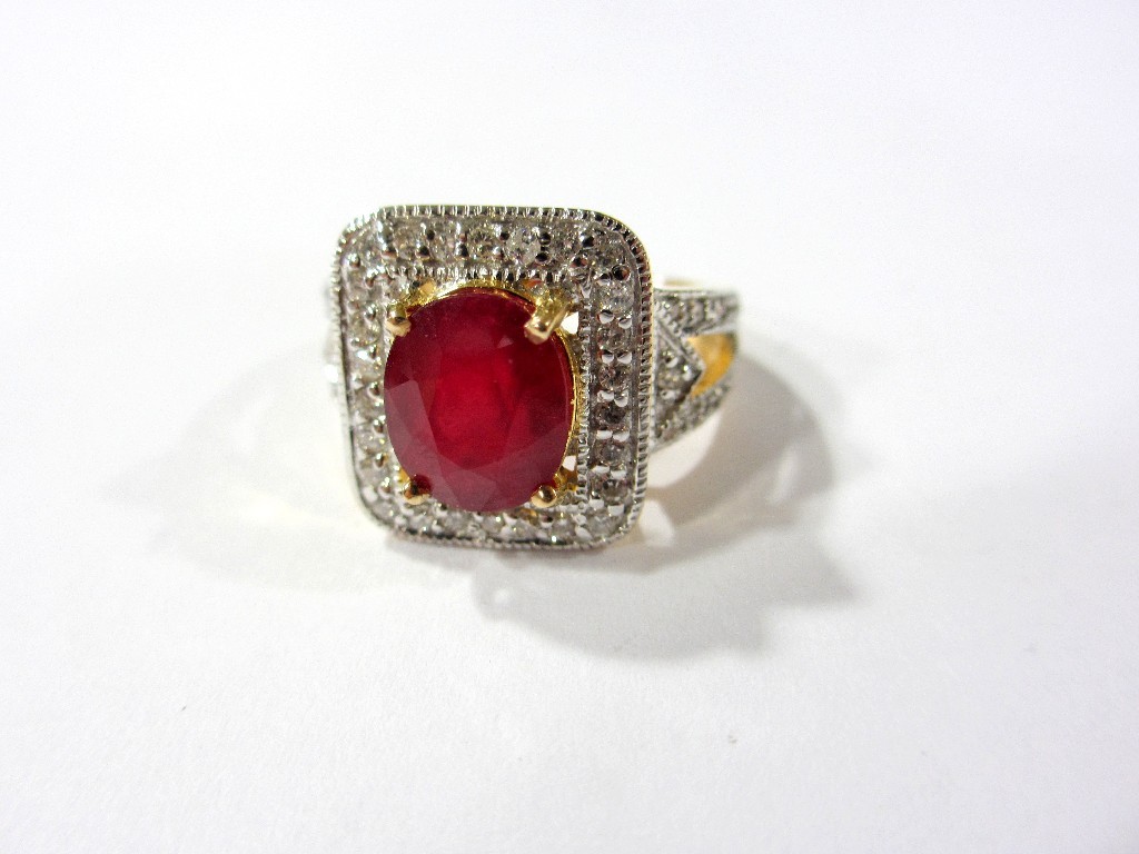 Appraisal: An attractive contemporary design ruby and diamond ring the oval