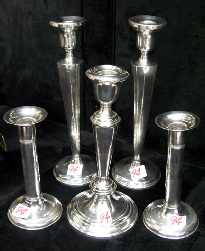 Appraisal: TWO PAIR AND A SINGLE STERLING SILVER CANDLESTICKS The taller