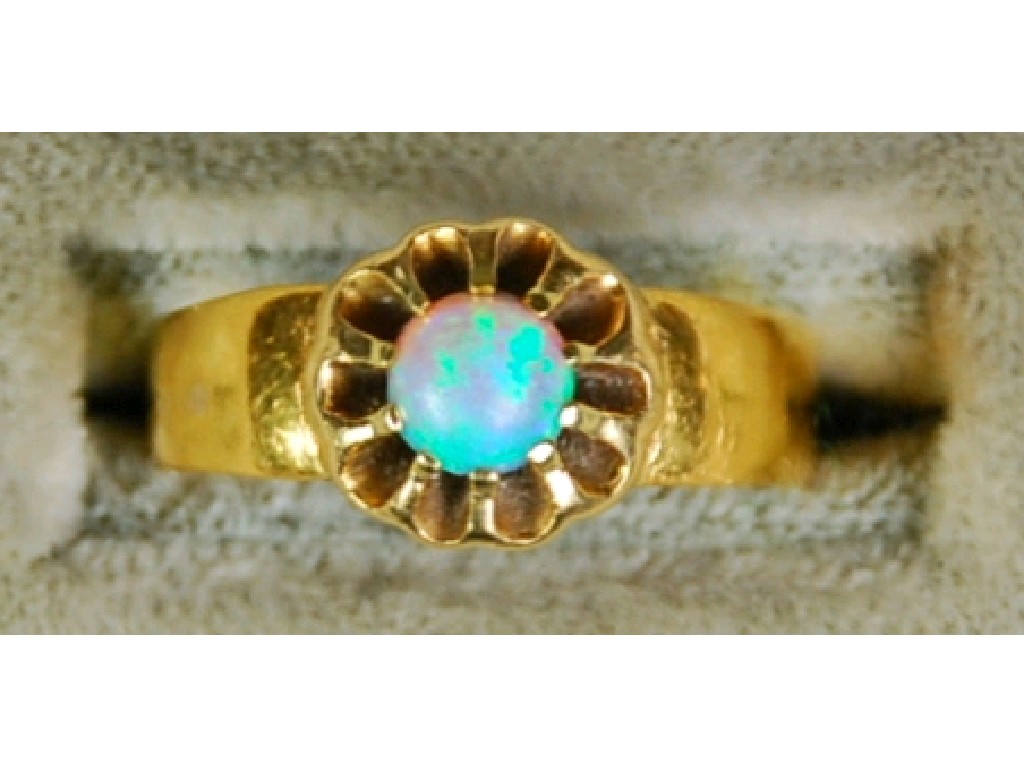 Appraisal: VICTORIAN BROAD GOLD RING claw set with a circular opal