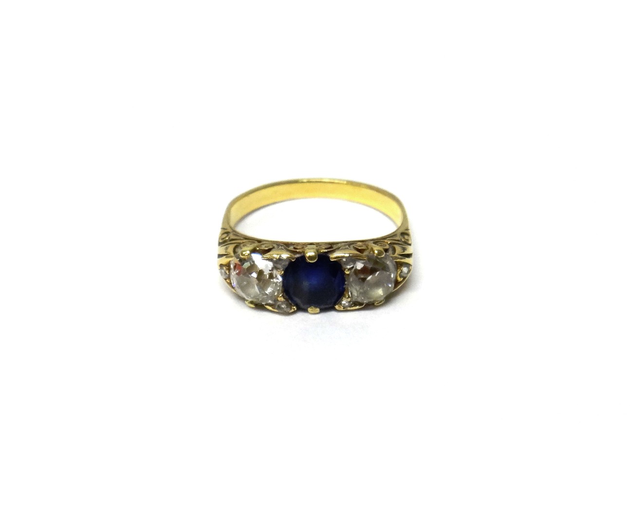 Appraisal: A gold diamond and sapphire set three stone ring mounted