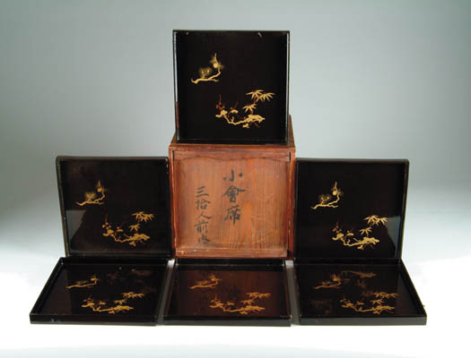 Appraisal: SET OF EIGHT ORIENTAL LACQUERWARE SQUARE TRAYS The brown ground