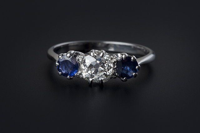 Appraisal: A sapphire and diamond three stone ring the central old-cut