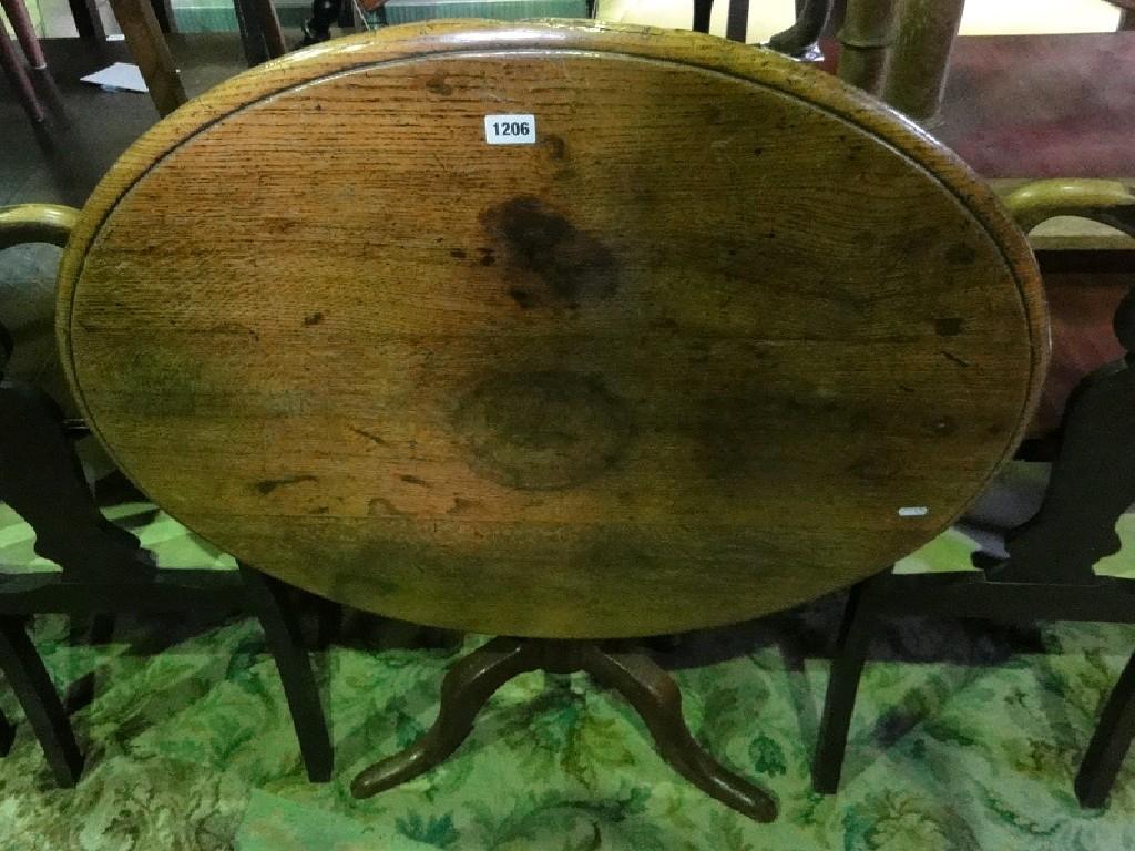 Appraisal: A th century oak tilt top occasional table of circular