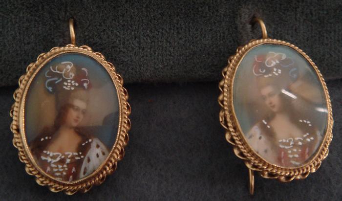 Appraisal: K YG HP portrait on ivory earrings dwt h Estimate