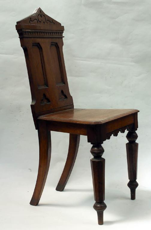 Appraisal: VICTORIAN OAK HALL CHAIR with panelled back raised on faceted