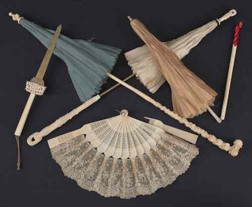 Appraisal: Three Chinese ivory handled parasols together with a hand fan