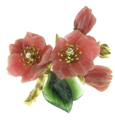 Appraisal: A carved hardstone blossom brooch Set with two small diamonds