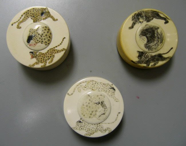 Appraisal: THREE JAPANESE IVORY SNUFF BOXES Meiji period each with stained