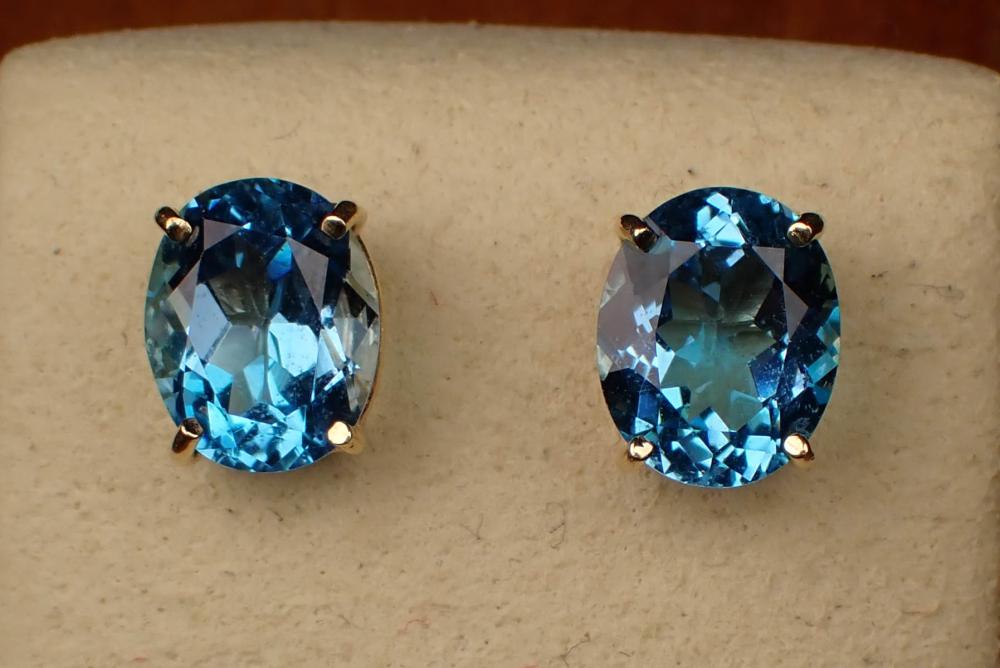 Appraisal: PAIR OF BLUE TOPAZ AND FOURTEEN KARAT GOLD EAR STUDS