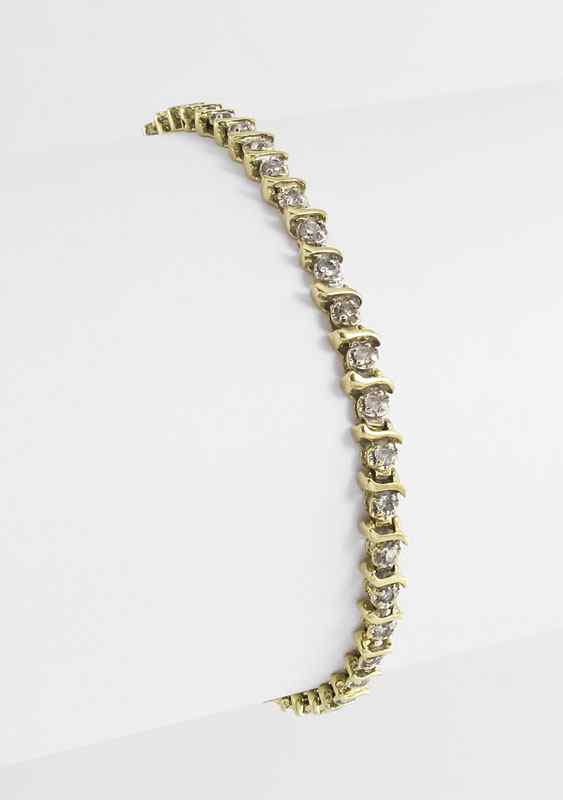 Appraisal: GOLD DIAMOND TENNIS BRACELET K yellow gold bracelet contains round