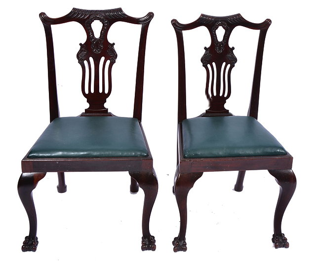 Appraisal: TWO CHIPPENDALE STYLE MAHOGANY DINING CHAIRS with carved and pierced