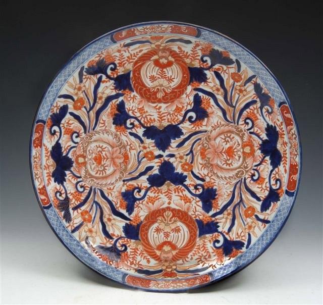 Appraisal: A LARGE JAPANESE POLYCHROME IMARI CHARGER decorated with stylised foliate