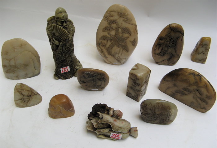 Appraisal: TWELVE CHINESE HAND CARVED HARDSTONES landscape boulders decorated in relief