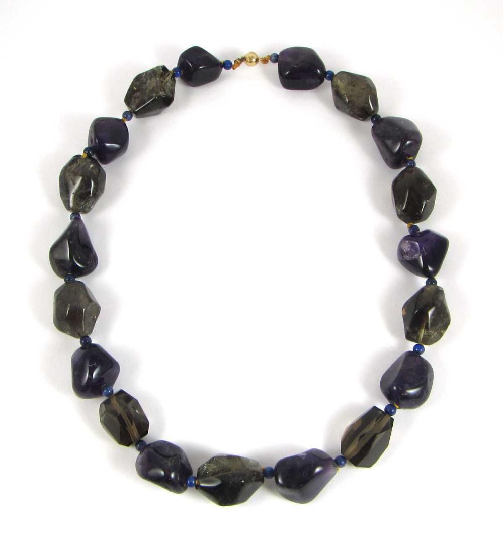 Appraisal: AMETHYST AND SMOKY QUARTZ CHUNKY BEAD NECKLACE - hand-knotted golden