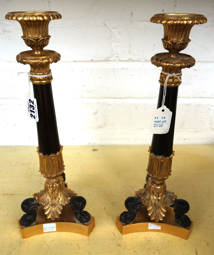 Appraisal: A pair of gilt and patinated ormolu candlesticks of Georgian