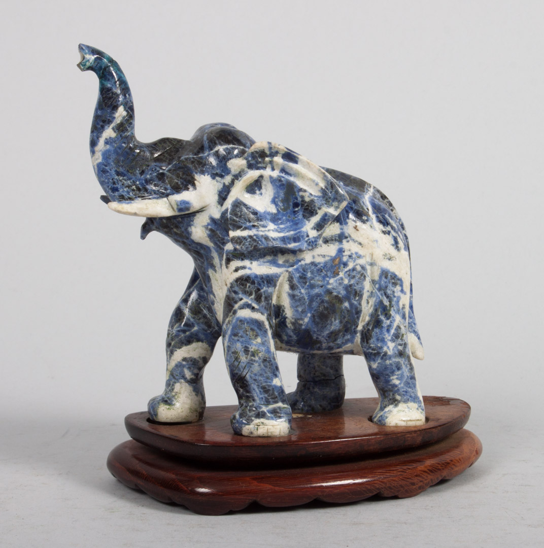 Appraisal: Chinese carved lapis elephant trumpeting elephant on wood base in