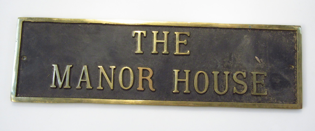 Appraisal: A part brass door plaque reading The Manor House with