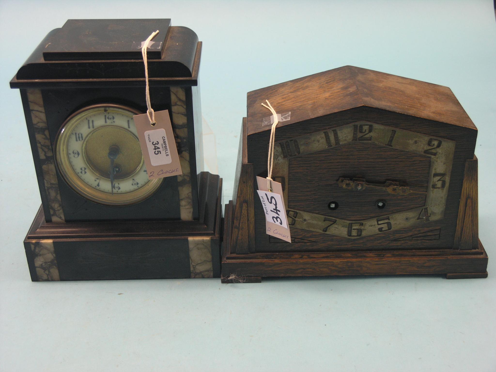 Appraisal: A Victorian black slate mantel clock with French timepiece movement