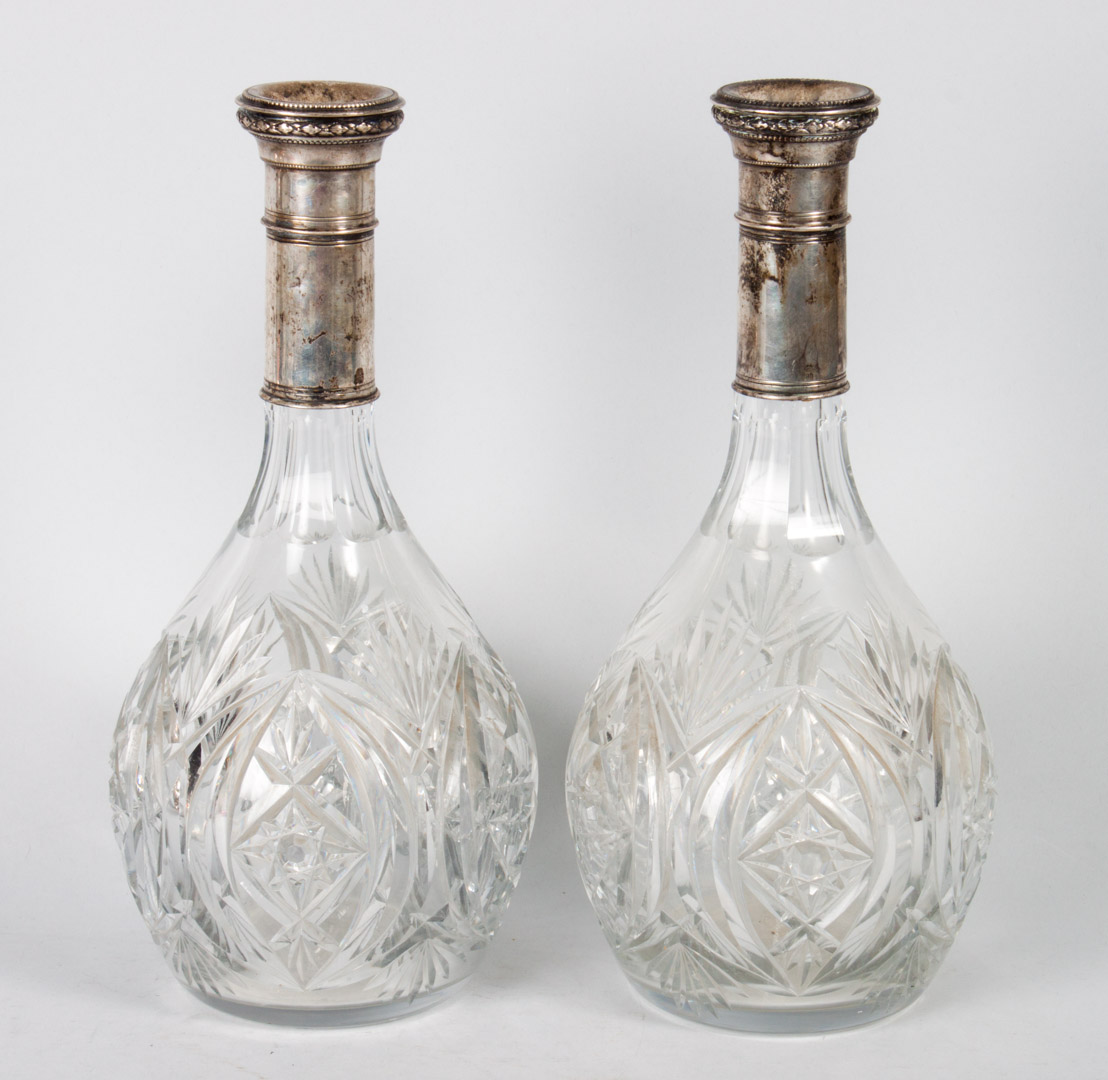 Appraisal: Pair of continental silver-mounted decanters cut glass bodies silver necks