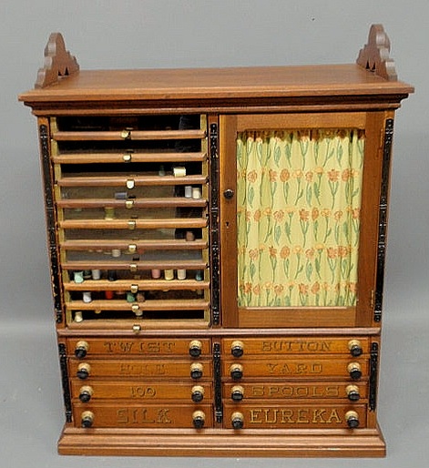 Appraisal: Victorian walnut spool display cabinet Eureka Silk with an elaborate