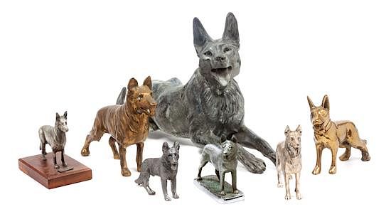 Appraisal: A Group of Seven Metal German Shepherd Figures Width of