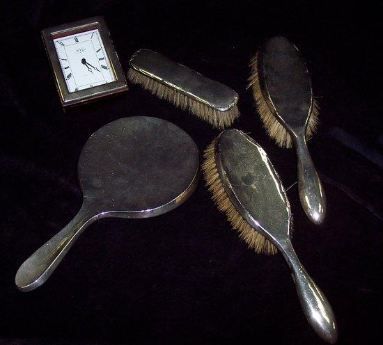 Appraisal: A silver backed dressing table set of four pieces and