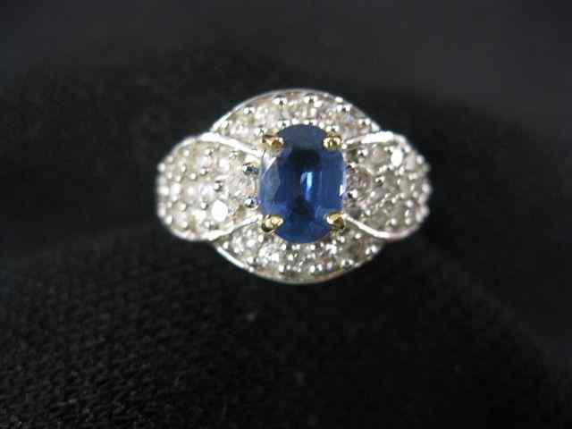 Appraisal: Sapphire Diamond Ring oval gem weighing carat surrounded by diamonds