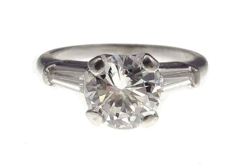 Appraisal: PLATINUM CT DIAMOND SOLITAIRE PLUS RING Platinum ring centers a