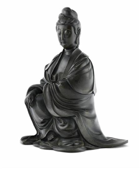 Appraisal: A Chinese silver inlaid bronze figure of Guanyin cast in