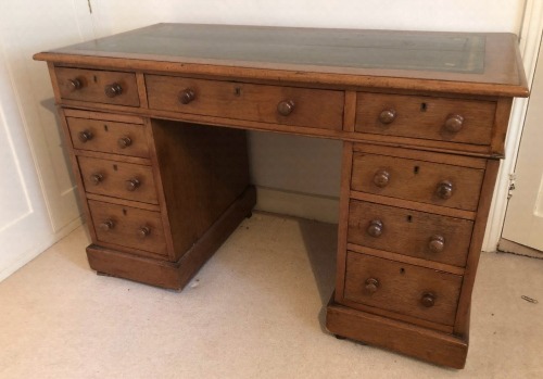 Appraisal: A Victorian oak twin pedestal desk with inset gilt leather