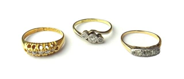 Appraisal: A gold and platinum diamond set three stone ring mounted