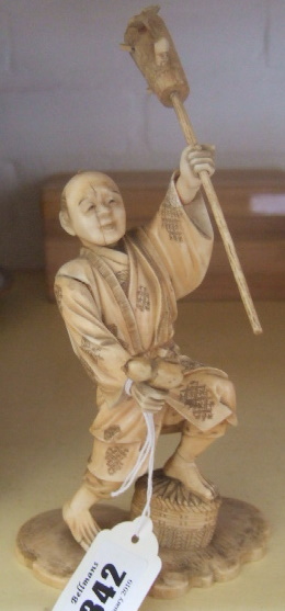 Appraisal: A Japanese ivory okimono of a farmer Meiji period -