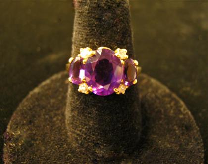 Appraisal: karat yellow gold amethyst and diamond ringOval cut amethyst framed