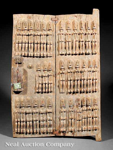 Appraisal: A Dogon Carved Wood Granary Door Mali two wood planks