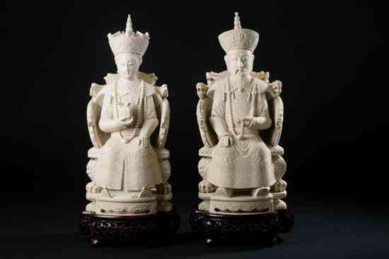 Appraisal: TWO CHINESE IVORY FIGURES OF EMPEROR AND EMPRESS Each seated