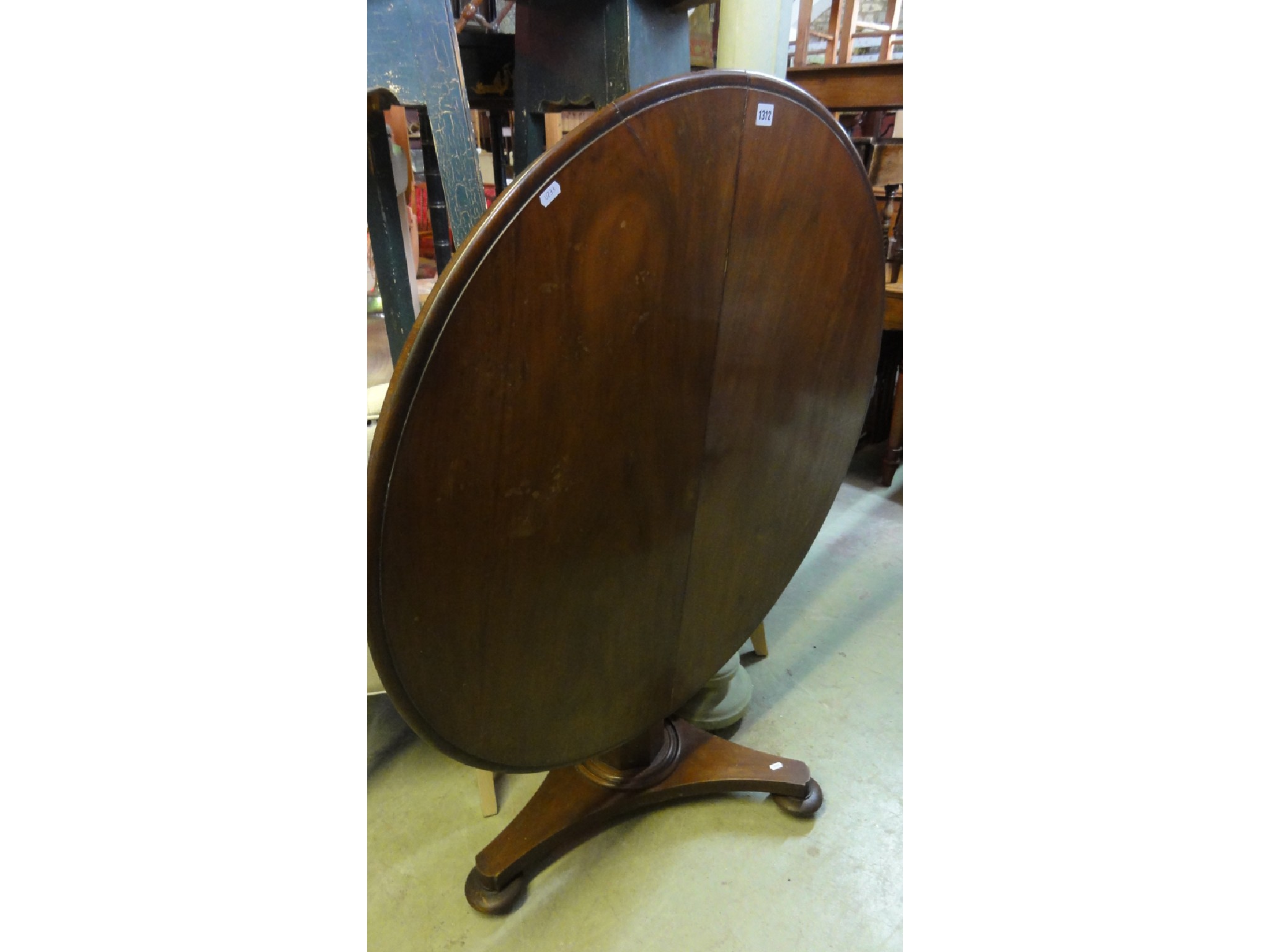 Appraisal: A Victorian mahogany tilt top loo table of circular form