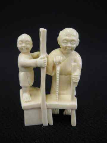 Appraisal: Carved Ivory Netsuke of a Carpenter with his son building