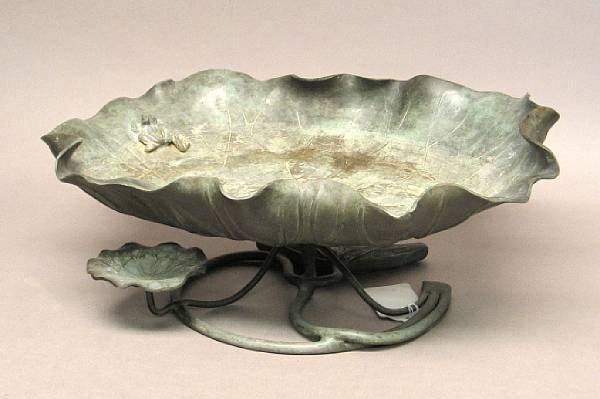 Appraisal: Two bronze decorations The first a Japanese patinated metal bowl