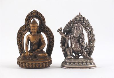 Appraisal: A Tibetan silver-coloured metal figure of Mahakala standing on a