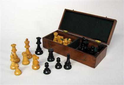 Appraisal: Fruitwood and ebonized wood chess set Comprising chess pieces in