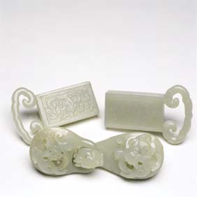 Appraisal: THREE JADE BELT FITTINGS Three antique Chinese carved jade belt