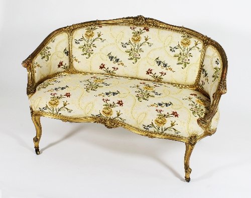 Appraisal: A carved and gilded canape of Louis XVI design upholstered