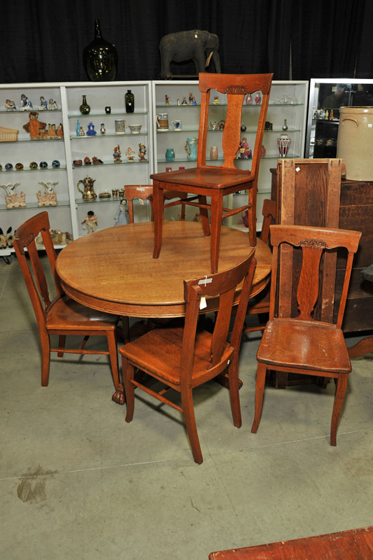 Appraisal: SEVEN PIECE DINING ROOM SET Oak pedastal table with two