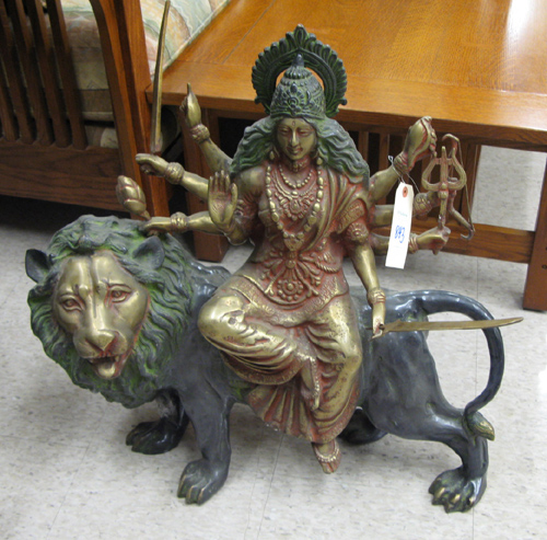 Appraisal: AN ASIAN BRONZE SCULPTURE the seated figure of Shiva riding