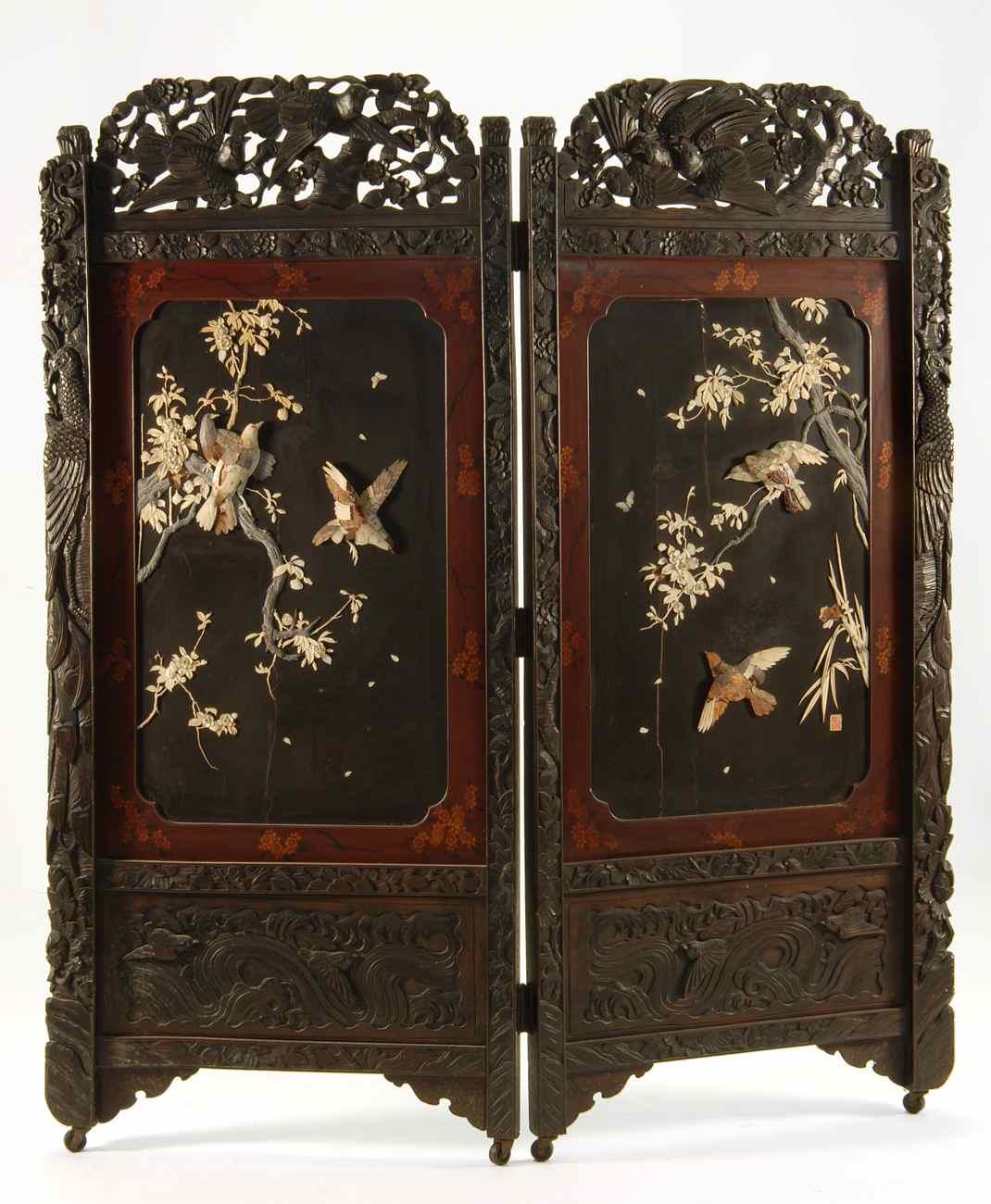 Appraisal: JAPANESE CARVED IVORY AND MOTHER-OF-PEARL TWO-PANEL FOLDING SCREEN Depicting birds