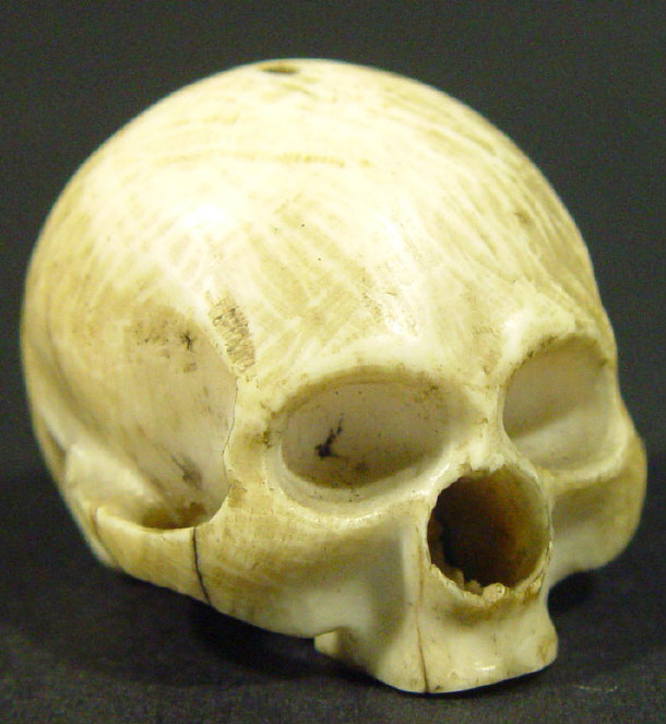 Appraisal: Miniature carved bone model of a skull cm in length