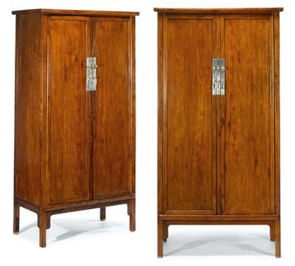 Appraisal: Pair of Chinese huanghuali tapering cabinets The rounded rectangular top